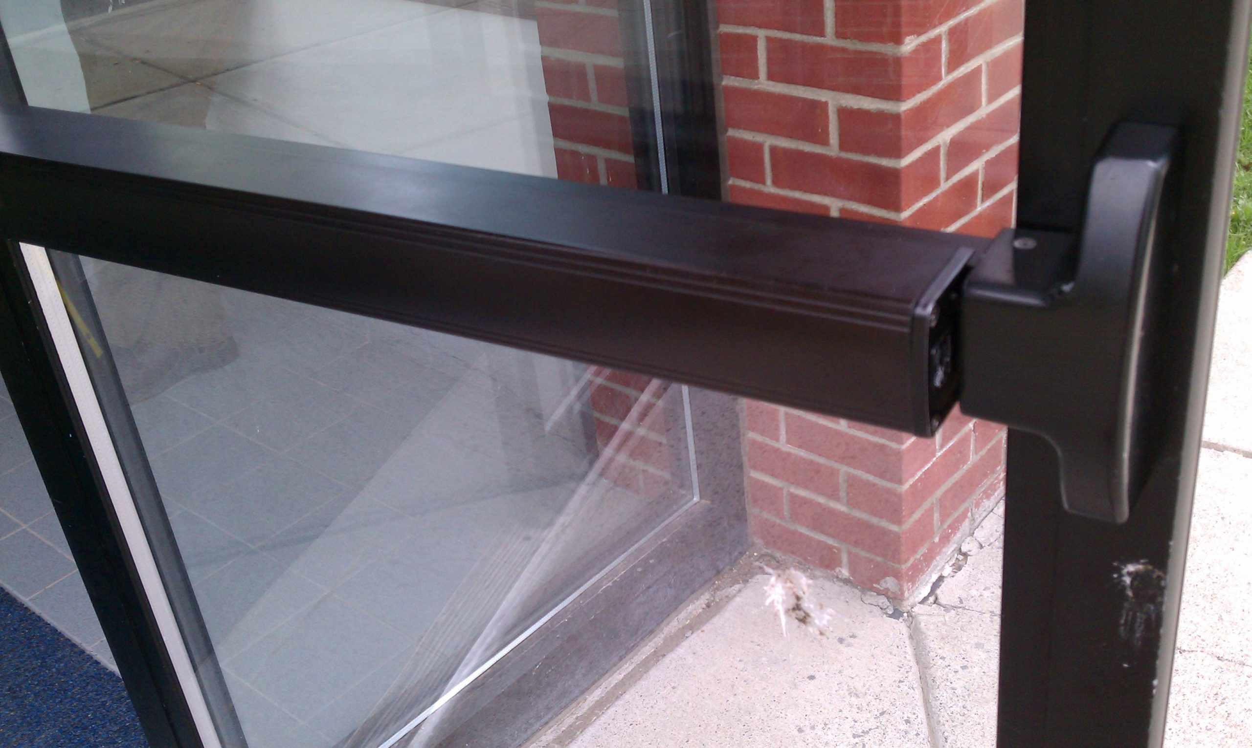 Panic bar on commercial glass exit door